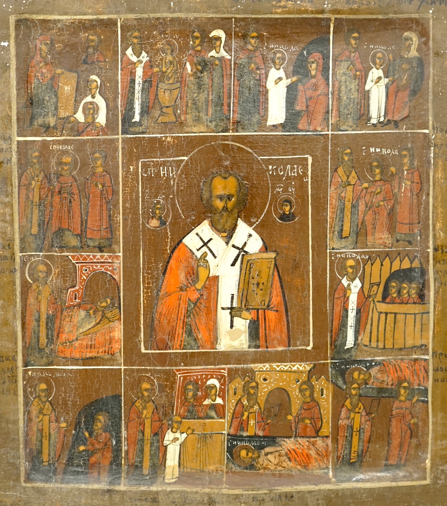 19th century Russian school, Icon, Life of St Nicholas, incised inscription verso, 31 x 26cm